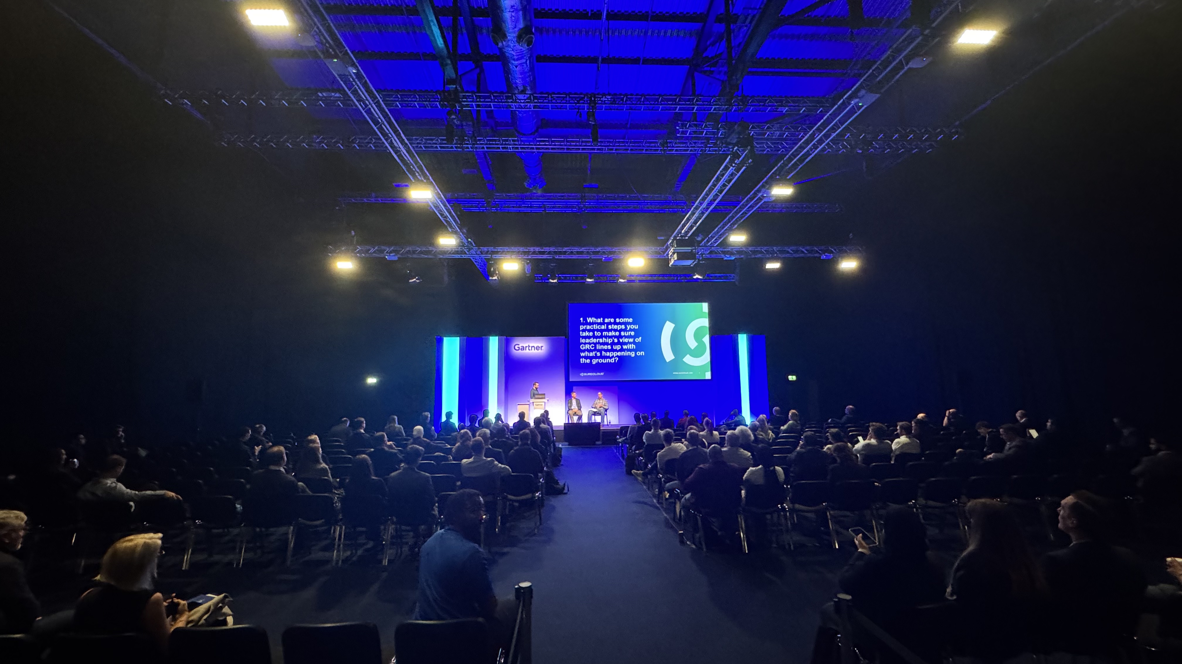 Audience at Gartner Security & Risk Management Summit 2025 keynote session featuring SureCloud presentation on Continuous Control Monitoring